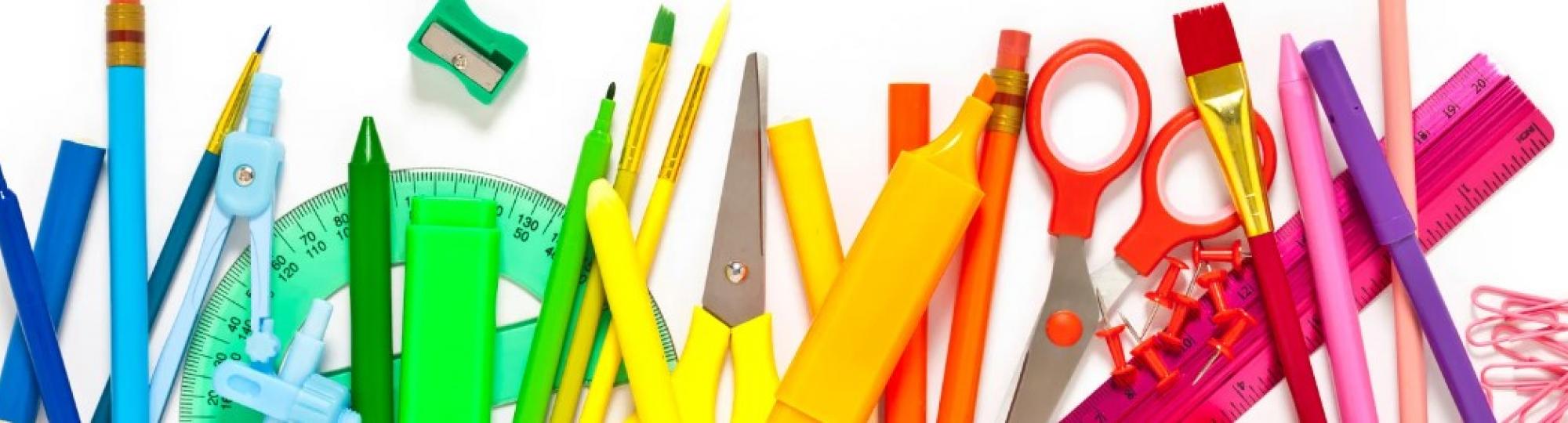 Picture of school supplies like pencils, notebooks and scissors